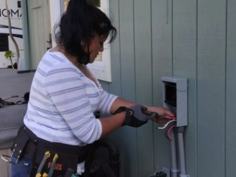 Licensed electrician wiring an exterior subpanel in Roebuck