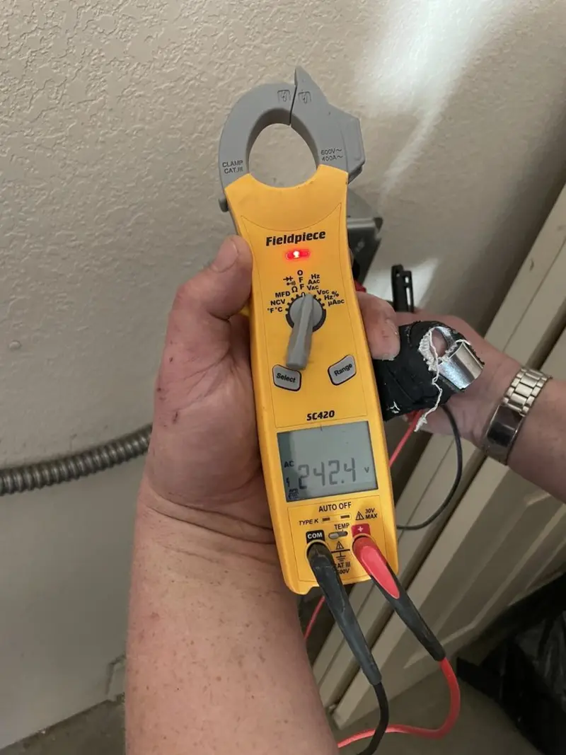 Voltage testing with clamp meter during Recessed Lighting Installation in Roebuck